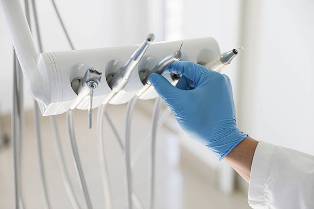 Professional Tooth Extraction technician working in Cedar Springs, MI